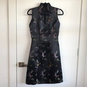 Hand made in Vietnam. High neck and low cut.